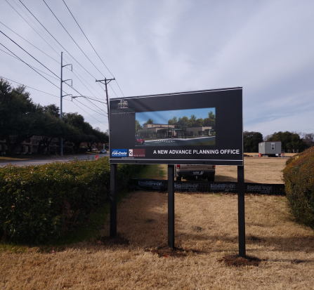 A billboard with an image of a house on it.