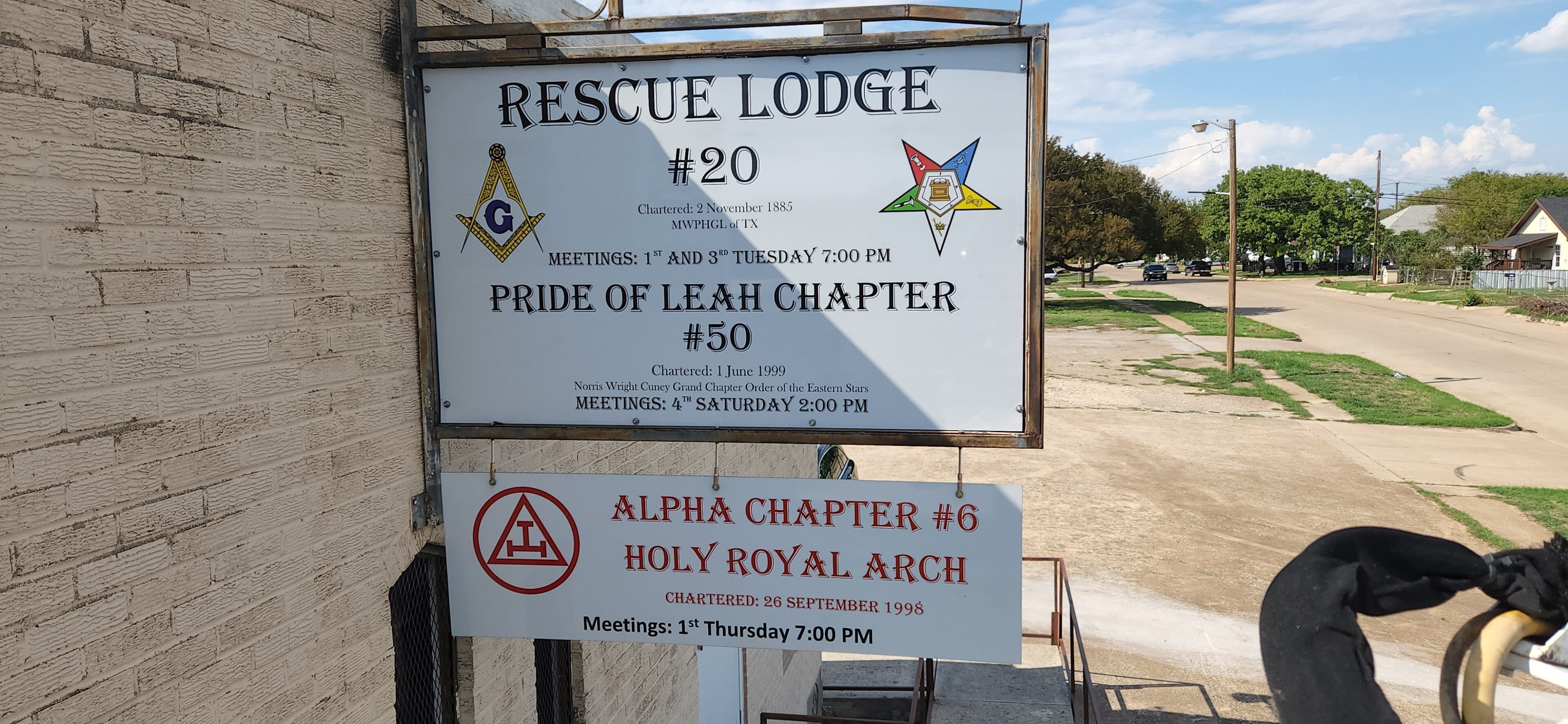 A sign for the lodge and alpha chapter of the royal arch.