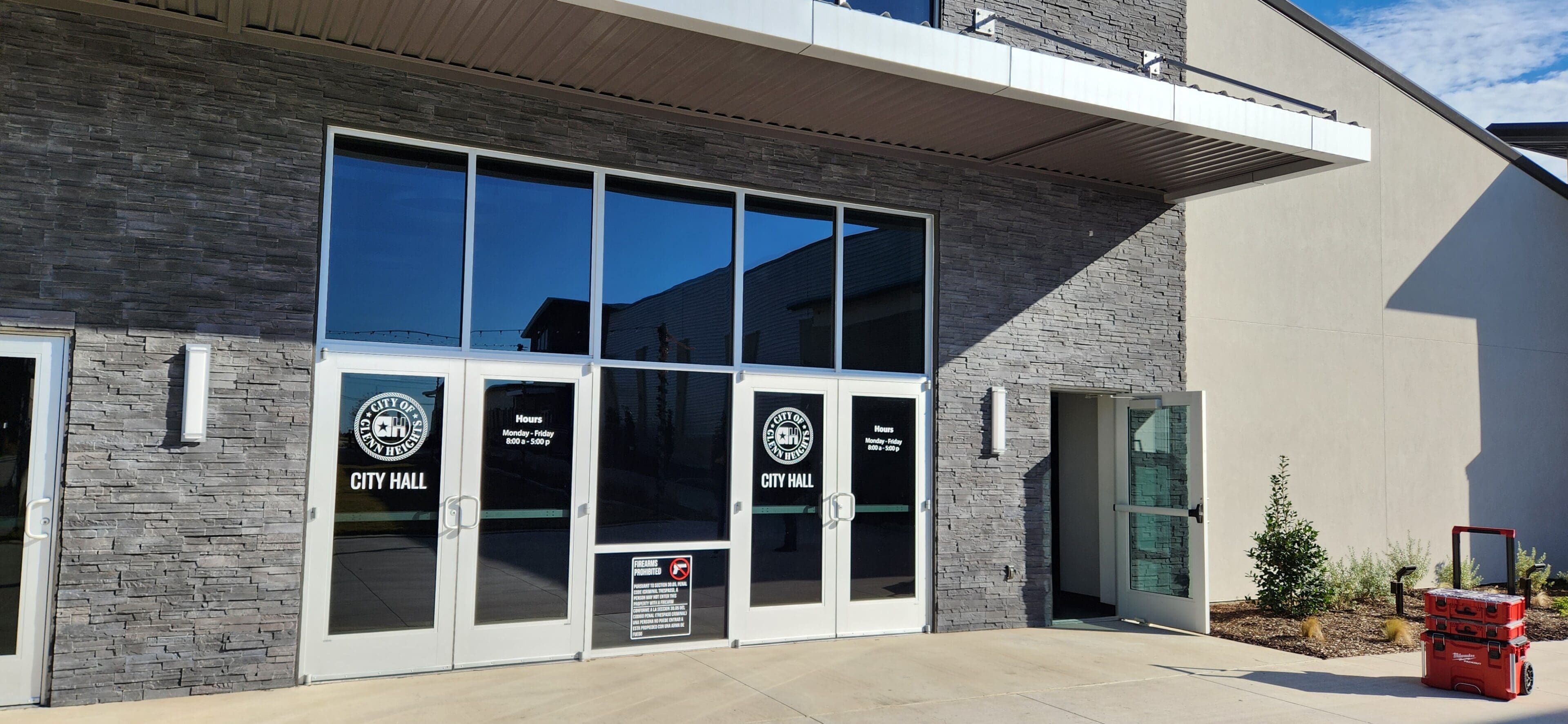 A building with two doors and windows on the outside.