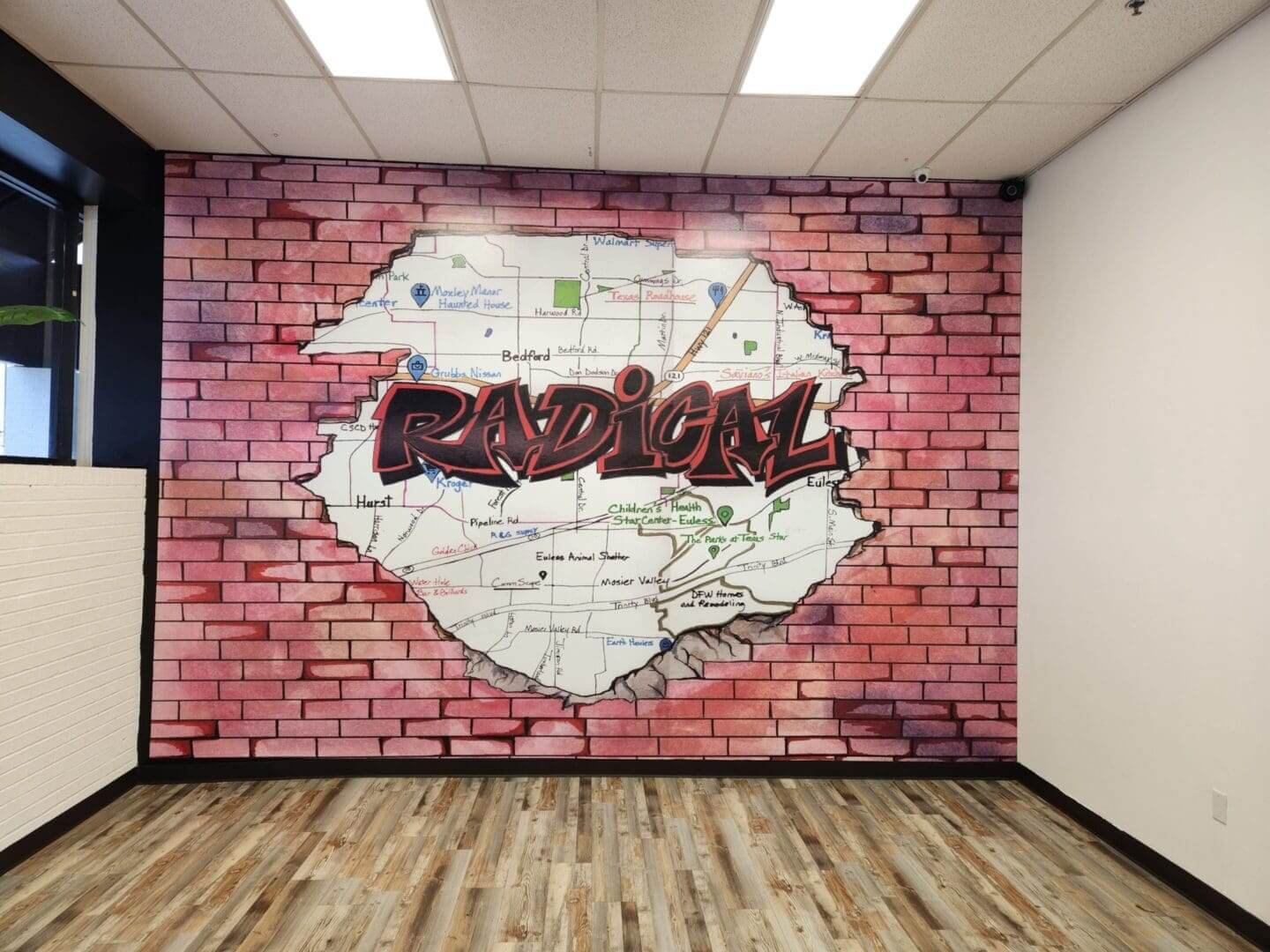A room with a wall that has graffiti on it.