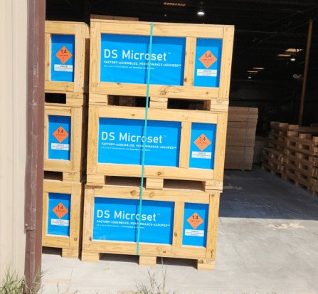 A stack of wooden crates in an industrial setting.